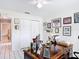 Home office featuring a desk, and ample storage with white tiled flooring at 7613 Bramblewood Dr, Port Richey, FL 34668
