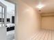 Bright, spacious walk-in closet with white tile flooring adjacent to the main bedroom at 7613 Bramblewood Dr, Port Richey, FL 34668