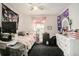 Bright bedroom featuring soft lighting, a window, and a vanity with decorations at 7639 Broad Pointe Dr, Zephyrhills, FL 33540
