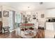 Bright dining area with a charming chandelier, a round table, and sliding glass doors to the backyard at 7639 Broad Pointe Dr, Zephyrhills, FL 33540