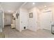 Bright entryway features tile floors, a coat rack, and neutral walls, creating a welcoming atmosphere at 7639 Broad Pointe Dr, Zephyrhills, FL 33540