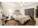 Serene main bedroom with a comfortable bed, stylish decor, and a peaceful ambiance at 7639 Broad Pointe Dr, Zephyrhills, FL 33540