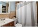 Clean and well-maintained bathroom with a modern vanity, coordinated fixtures, and a shower-tub combo at 7702 New York Dr, Tampa, FL 33619
