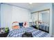 Charming bedroom with whimsical decor, featuring soft lighting and ample space for relaxation and personalization at 7702 New York Dr, Tampa, FL 33619