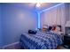 Cozy bedroom with custom wall decor and unique lighting that creates a personalized and comfortable retreat at 7702 New York Dr, Tampa, FL 33619
