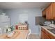 Bright kitchen featuring a dining area and modern appliances at 7702 New York Dr, Tampa, FL 33619
