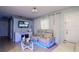 Inviting living room featuring modern furniture, a TV, and soft lighting at 7702 New York Dr, Tampa, FL 33619