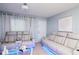 Comfortable living room with modern seating, decorative accents, and ample natural light at 7702 New York Dr, Tampa, FL 33619