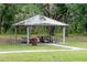 Park pavilion with picnic tables provides a shaded area for outdoor gatherings at 7702 New York Dr, Tampa, FL 33619