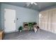 Relaxing screened porch with seating, plants, and outdoor access at 7702 New York Dr, Tampa, FL 33619
