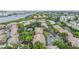 An aerial view showing the community, with a river in the background and mature trees at 820 Normandy Trace Rd, Tampa, FL 33602