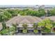 Waterfront property features lush landscaping, private garages, and a beautiful tile roof at 820 Normandy Trace Rd, Tampa, FL 33602