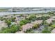 Aerial view of the community featuring lush greenery, waterway access, and ample parking at 820 Normandy Trace Rd # 820, Tampa, FL 33602