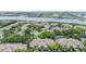Community features waterfront views, lush landscaping, a swimming pool and well-maintained grounds at 820 Normandy Trace Rd, Tampa, FL 33602