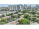 Luxury property featuring city views, lush landscaping, mature trees, and ample parking at 820 Normandy Trace Rd, Tampa, FL 33602