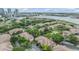 Waterfront property featuring lush landscaping, mature trees, and access to beautiful waterways at 820 Normandy Trace Rd, Tampa, FL 33602