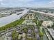 Scenic aerial shot showcasing the community, with water views, and lush landscaping at 820 Normandy Trace Rd, Tampa, FL 33602