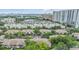 Community features city views, lush landscaping, mature trees, and ample parking at 820 Normandy Trace Rd, Tampa, FL 33602