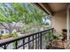 Private balcony with lush greenery offers a tranquil view of the neighborhood at 820 Normandy Trace Rd # 820, Tampa, FL 33602