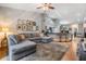 Open-concept living room flows to kitchen area featuring comfortable seating and hardwood floors at 820 Normandy Trace Rd, Tampa, FL 33602
