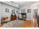 Bright office loft boasts hardwood floors, modern workstation setup, and eclectic decor at 820 Normandy Trace Rd, Tampa, FL 33602