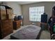 An interior shot of a bedroom featuring a window and a dresser at 9100 Mlk N St # 503, St Petersburg, FL 33702