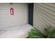 This exterior home view shows the front door on a home that has neutral colored siding with fern at 9100 Mlk N St # 503, St Petersburg, FL 33702