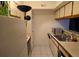 A kitchen showing a stainless steel sink and a microwave over the counter in the kitchen at 9100 Mlk N St # 503, St Petersburg, FL 33702