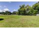 Expansive backyard enclosed by a white fence, providing ample space and privacy at 9918 Davis Rd, Tampa, FL 33637