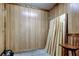 Unfinished basement featuring paneled walls and ample storage space for easy organization at 9918 Davis Rd, Tampa, FL 33637