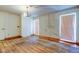 Bedroom featuring hardwood floors and a chandelier at 9918 Davis Rd, Tampa, FL 33637