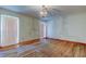 Bedroom with light wood floors and a chandelier at 9918 Davis Rd, Tampa, FL 33637