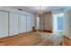 Bedroom with wood flooring, two closets, and an ensuite bathroom at 9918 Davis Rd, Tampa, FL 33637