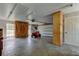 Spacious garage with natural light, storage cabinets and an overhead garage door at 9918 Davis Rd, Tampa, FL 33637