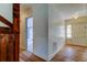 Charming hallway featuring hardwood floors and vintage wallpaper details at 9918 Davis Rd, Tampa, FL 33637