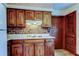 Classic kitchen with wood cabinetry, white countertops, and vintage details at 9918 Davis Rd, Tampa, FL 33637
