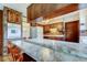 Kitchen view featuring a breakfast bar with seating and an appliance garage at 9918 Davis Rd, Tampa, FL 33637
