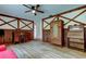 Living room featuring hardwood floors, decorative wood accents, and vintage-style furnishings at 9918 Davis Rd, Tampa, FL 33637