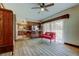 Spacious living room with hardwood floors and seamless access to kitchen and dining area at 9918 Davis Rd, Tampa, FL 33637