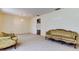 Bright and airy living room with traditional furniture and carpeted floors at 9918 Davis Rd, Tampa, FL 33637