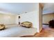 Spacious living room with neutral carpet, classic furnishings, and vintage wallpaper at 9918 Davis Rd, Tampa, FL 33637