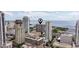 An aerial view of waterfront buildings surrounded by stunning cityscape and glistening blue waters at 1 Beach Se Dr # 2011, St Petersburg, FL 33701