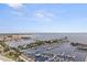 Panoramic aerial view of a marina with many boats docked, set against a coastal city skyline with a distant horizon at 1 Beach Se Dr # 2011, St Petersburg, FL 33701
