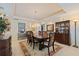 Inviting dining room featuring a classic wooden table set, complemented by elegant decor and ample natural light at 1 Beach Se Dr # 2011, St Petersburg, FL 33701