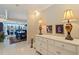 Elegant foyer featuring a dresser with decorative lamps and artwork, leading to the dining and living areas at 1 Beach Se Dr # 2011, St Petersburg, FL 33701