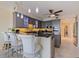 Modern kitchen features granite countertops, gray cabinets, tiled flooring and stainless steel appliances at 1 Beach Se Dr # 2011, St Petersburg, FL 33701