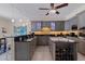 Modern kitchen features granite countertops, gray cabinets, tiled flooring and stainless steel appliances at 1 Beach Se Dr # 2011, St Petersburg, FL 33701
