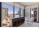 Bright living area features a large window with city views and modern furnishings at 1 Beach Se Dr # 2011, St Petersburg, FL 33701