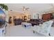 Elegant living room with plush sofas, decorative accents, and a seamless flow to dining and kitchen areas at 1 Beach Se Dr # 2011, St Petersburg, FL 33701