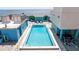 Rooftop pool with comfortable lounge chairs and umbrellas at 1 Beach Se Dr # 2011, St Petersburg, FL 33701